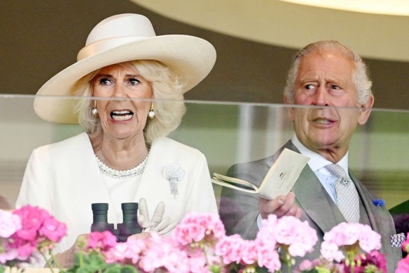 ASCOT, UNITED KINGDOM - JUNE 24: (EMBARGOED FOR PUBLICATION IN UK NEWSPAPERS UNTIL 24 HOURS AFTER CREATE DATE AND TIME) Queen Camilla, King Charles III and Lady Gabriella Windsor watch, from the Royal ...