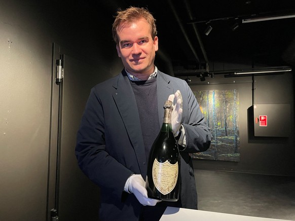 Thomas Rosendahl Andersen, head of the wine department at the auction house Bruun Rasmussen, poses with a magnum of Champagne served at Princess Diana and Prince Charles 1981&#039;s wedding, in Kongen ...