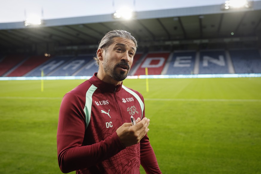 Switzerland's assistant coach Davide Calla speaks during an interview after a press conference one day ahead of the UEFA Nations League soccer match between Scotland and Switzerland at the Hampde ...
