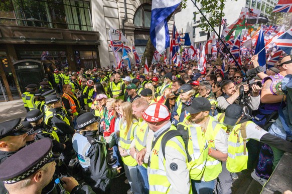 epa12962301 Police take security measures as people gather in Kingsway ahead of a 'Unite the Kingdom' march and rally in London, Britain, 16 May 2026. The march is organized by Stephen Yaxle ...