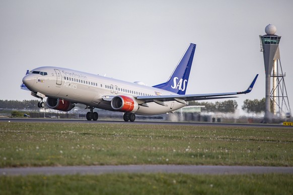 AS Scandinavian Airlines Boeing 737-800 SAS Scandinavian Airlines Boeing 737-800 aircraft as seen during taxiing, rotation, take off and fly phase while departing from Amsterdam Schiphol AMS EHAM. The ...
