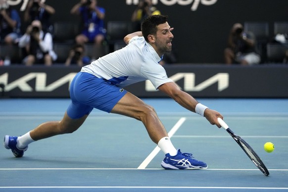 Novak Djokovic of Serbia plays a forehand return to Taylor Fritz of the U.S. during their quarterfinal match at the Australian Open tennis championships at Melbourne Park, Melbourne, Australia, Tuesda ...