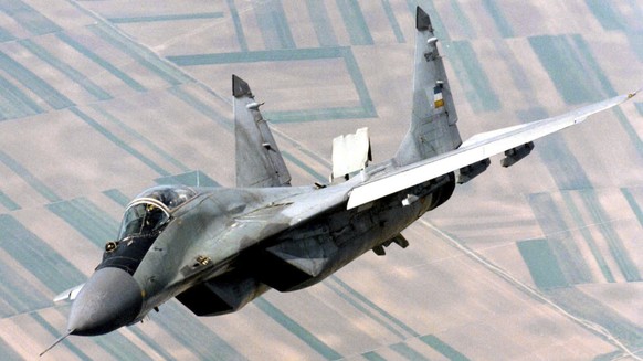 FILE - A Yugoslav airforce Mig-29 fighter flies over Belgrade, on June 1998, during patrol duty. Slovakia was offered 12 new military helicopters by the United States as compensation for the MiG-29 fi ...