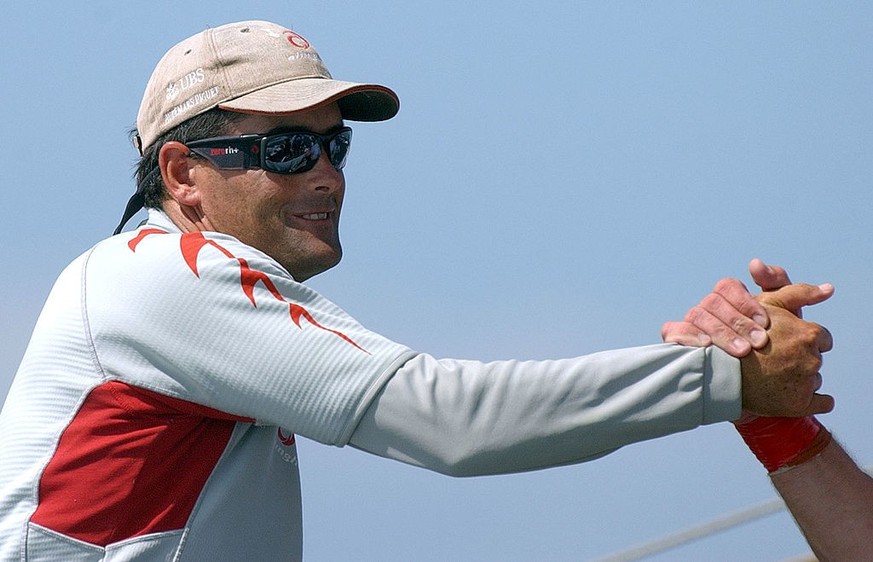 AUCKLAND, NEW ZEALAND - FEBRUARY 18: Alinghi Skipper Russell Coutts shakes hands with a team mate after Alinghi&#039;s win over Team New Zealand in race 3, Tuesday. Alinghi beat Team New Zealand by 23 ...