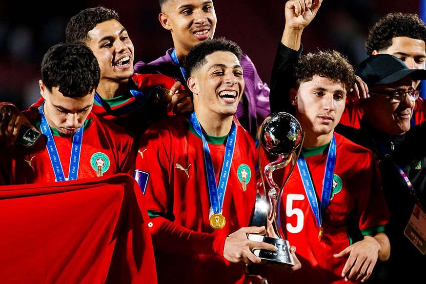SANTIAGO, CHILE - OCTOBER 19: Houssam Essadak of Morocco celebrates and hold the trophy after winning the FIFA U-20 World Cup Chile 2025 final match between Argentina and Morocco at Estadio Nacional J ...