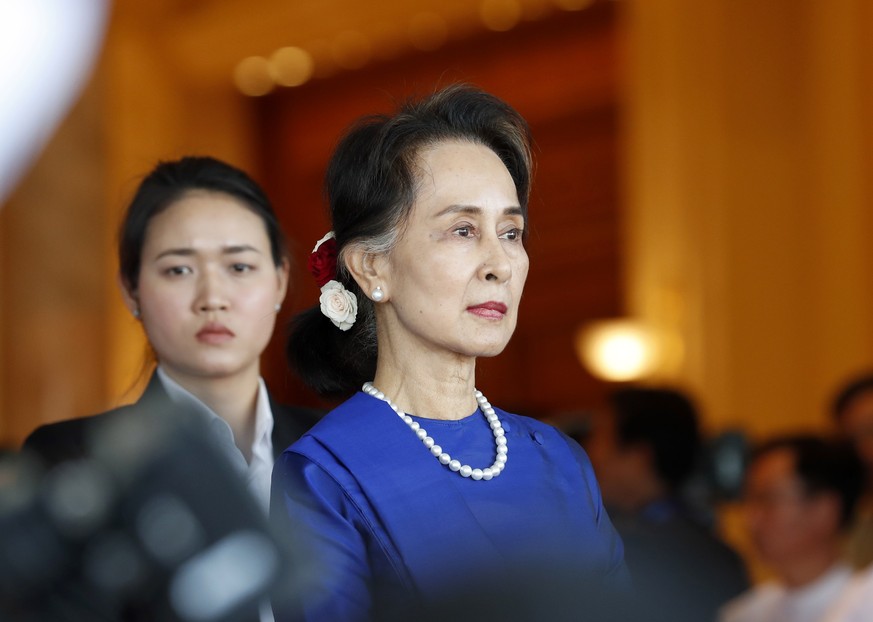 epa09224676 (FILE) - Myanmar State Counselor Aung San Suu Kyi (R) waits for the arrival of Chinese President Xi at the presidential house in Naypyitaw, Myanmar, 17 January 2020 (reissued 24 May 2021). ...