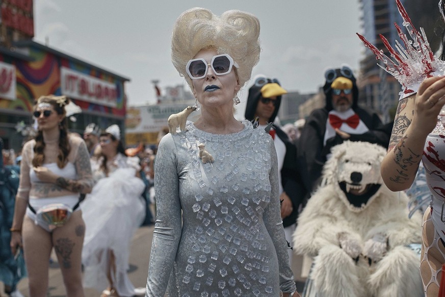 Revelers march during the Mermaid Parade in the Coney Island section of the Brooklyn borough of New York, Saturday, June 17, 2023. (AP Photo/Andres Kudacki)
