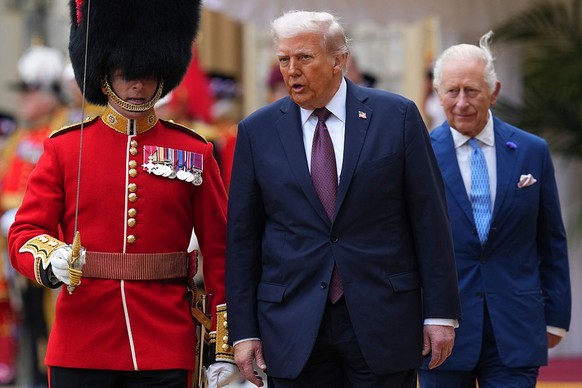 WINDSOR, ENGLAND - SEPTEMBER 17: US President Donald Trump (R) and King Charles III (C) review the Guard of Honour after their arrival at Windsor Castle on day two of the US President Donald Trump&#03 ...