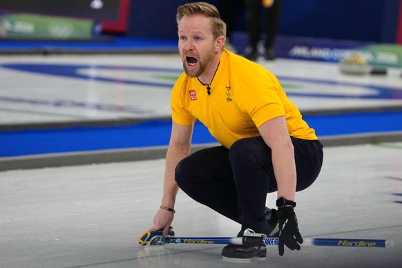 Sweden's Niklas Edin yells during the men's curling round robin session against Canada, at the 2026 Winter Olympics, in Cortina d'Ampezzo, Italy, Friday, Feb. 13, 2026. (AP Photo/Misper ...