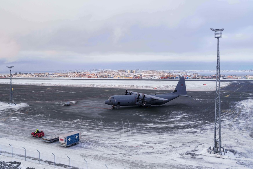 A Royal Danish Air Force military plane is seen at the airport of Nuuk, Greenland, on Thursday, Jan. 15, 2026. (AP Photo/Evgeniy Maloletka)
Greenland Daily Life