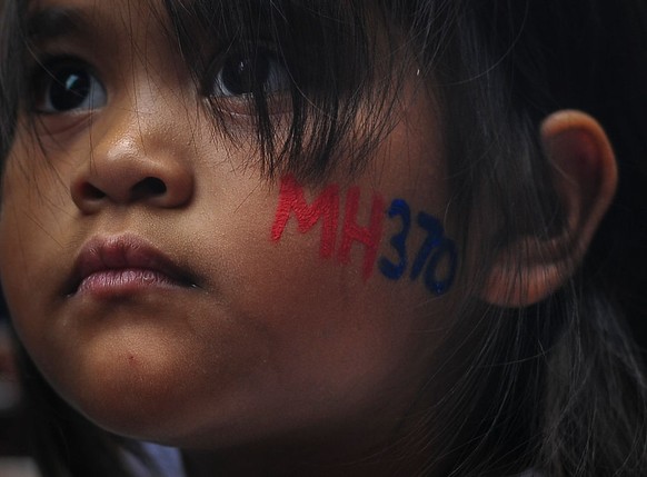 A child has her face painted with MH370 during a remembrance ceremony to mark the second anniversary of the plane&#039;s disappearance, in Kuala Lumpur, Malaysia, 06 March 2016 Mohd Daud/NurPhoto (Pho ...
