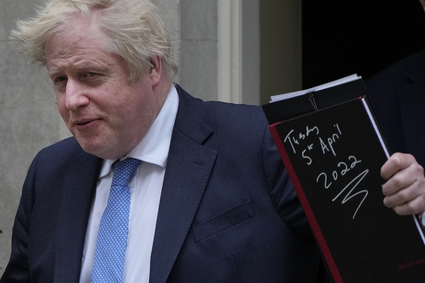 Britain&#039;s Prime Minister Boris Johnson waves to the media as he leaves 10 Downing Street for the House of Commons to make a statement about Downing Street parties during the coronavirus lockdowns ...