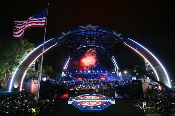 Fireworks go off as Justin Gaethje celebrates after defeating Ilia Topuria in a lightweight title bout during UFC Freedom 250 on the South Lawn of the White House, Monday, June 15, 2026, in Washington ...