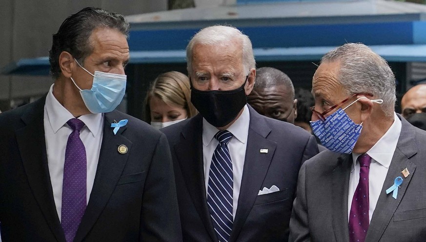 FILE - This photo from Friday, Sept. 11, 2020, shows President Joe Biden, center, as a presidential candidate walking with New York Gov. Andrew Cuomo, left, and Sen. Chuck Schumer of N.Y., after arriv ...