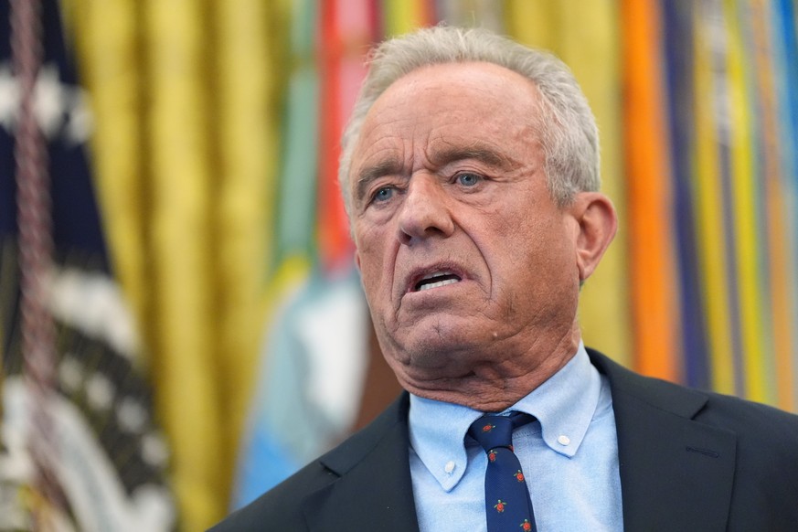 FILE - Health and Human Services Secretary Robert F. Kennedy Jr., speaks during a meeting to sign an executive order about vaccines, Aug. 10, 2026, in the Oval Office of the White House in Washington. ...