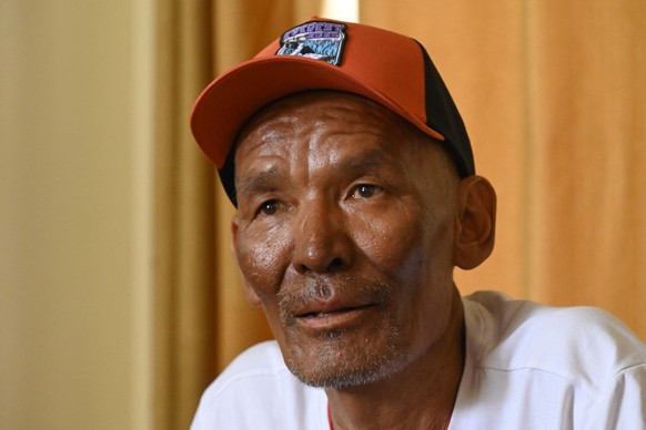 Everest survivor Dawa Sherpa speaks during an interview with AFP in Kathmandu on June 18, 2026. Dawa, a Nepali mountaineer who spent six days dragging himself off Mount Everest after being abandoned h ...