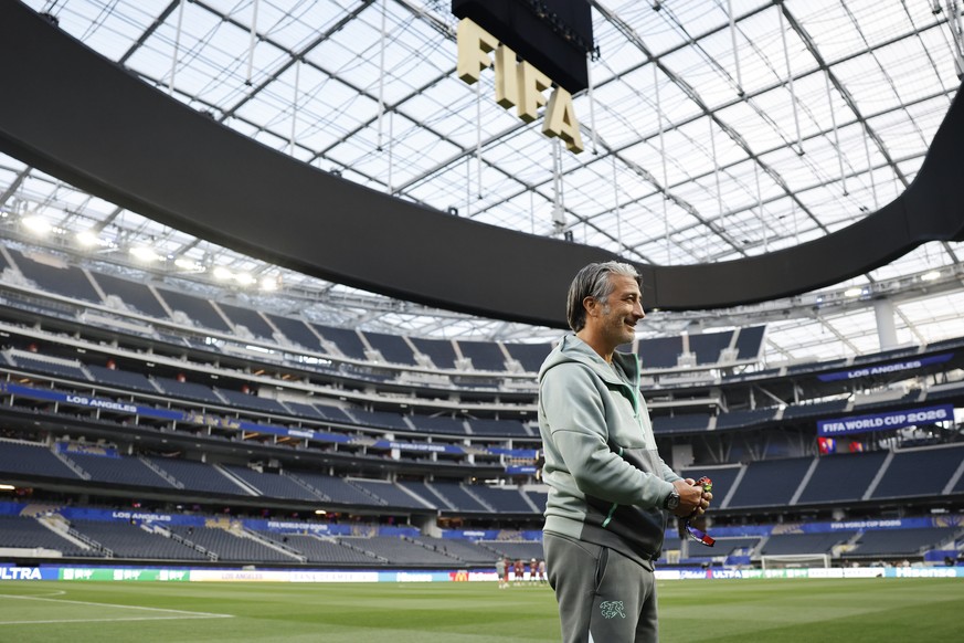 Switzerland's head coach Murat Yakin takes a first look in the stadium prior to a press conference one day ahead of the World Cup Group B soccer match between Switzerland and Bosnia Herzegovina a ...