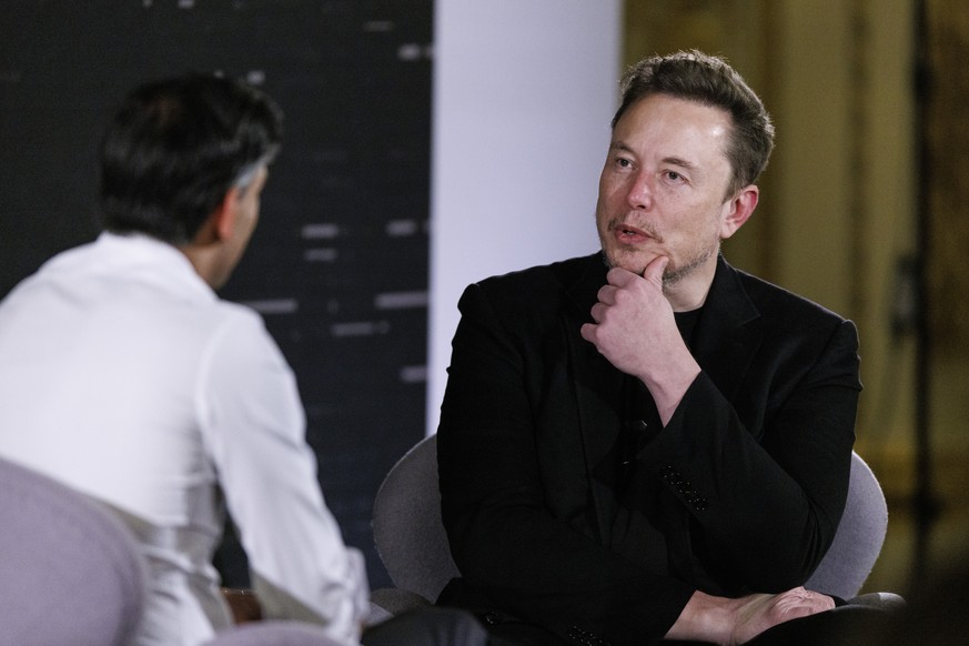 epa10955394 British Prime Minister Rishi Sunak (L) and US tech entrepreneur Elon Musk (R), owner of Tesla, SpaceX and X, attend a conversation event in central London, Britain, 02 November 2023. The c ...
