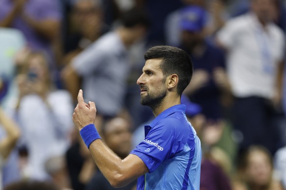 epa10853695 Novak Djokovic of Serbia reacts while playing against Daniil Medvedev of Russia during the Men&#039;s Final match at the US Open Tennis Championships at the Flushing Meadows, New York, USA ...