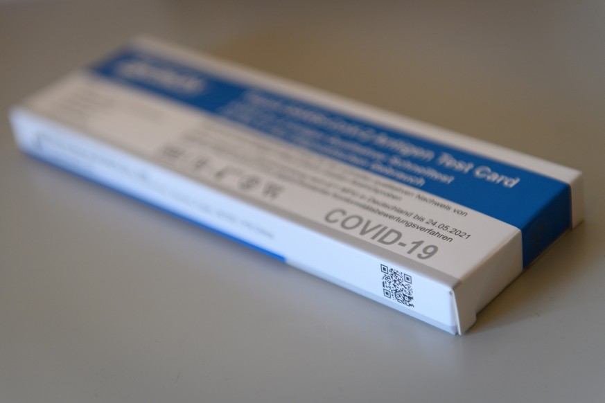 epa09099408 A COVID-19 rapid antigene self-test is seen in Garmisch-Partenkirchen, Germany, 26 March 2021. The widespread and regular use of self-tests is believed to be a key element to re-establish  ...