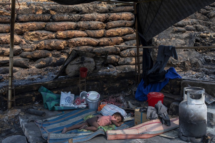 March 24, 2021: March 24, 2021, Cox s Bazaar, Bangladesh: A rohingya boy sleep in a burned house where a massive fire broke out two days ago and destroyed thousands of shelters and at least fifteen pe ...