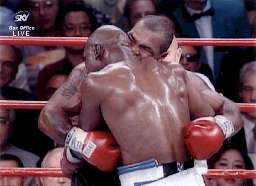 Video still from SKY SPORTS showing Mike Tyson as he bites Evander Holyfield on the right ear in the third round of their WBA Heavyweight match at the MGM Grand in Las Vegas last night, 28 June 1997.  ...