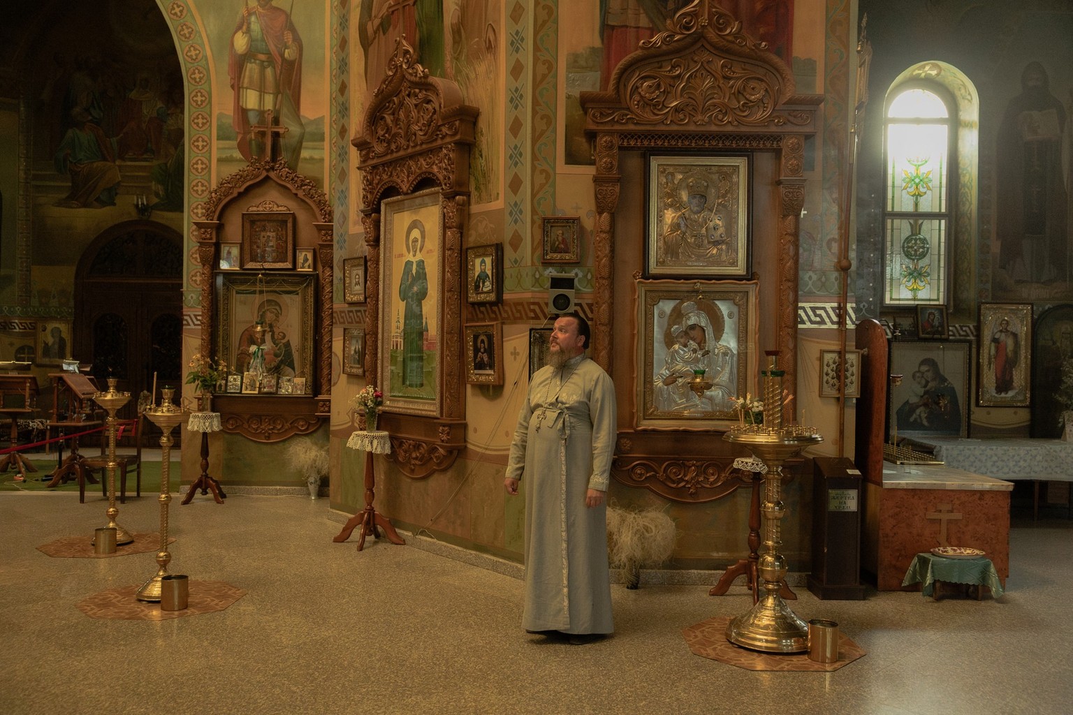 A priest Serhii Kapitoneko, stands in the Holy Trinity Cathedral of the Ukrainian Orthodox Church, commonly referred to by the exonym Ukrainian Orthodox Church of the Moscow Patriarchate, in Kramators ...