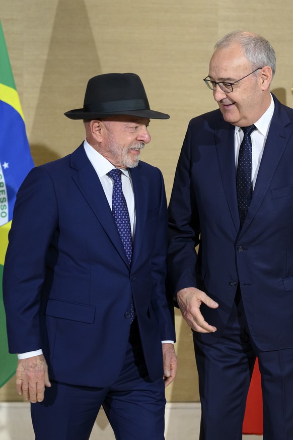 Swiss Federal President Guy Parmelin, right, speaks with Brazil's President Luiz Inacio Lula da Silva, left, prior to a bilateral meeting on the sideline of the the Evian G7 summit in Geneva, Swi ...