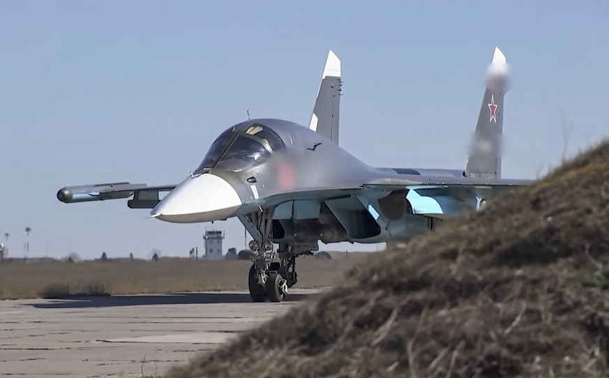 epa09898364 A handout still image taken from a handout video made available by the Russian Defence Ministry&#039;s press-service shows a Russian fighter-bombers Su-34 preparing to take off to carry ou ...