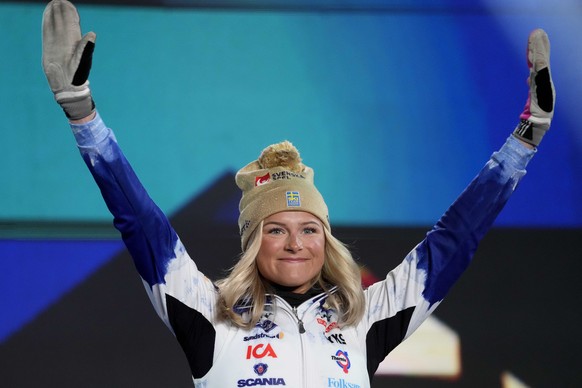 Third Sweden&#039;s Frida Karlsson celebrates during the medal ceremony for the Women 30 km Mass Start Classic competition at the Nordic World Championships in Planica, Slovenia, Saturday, March 4, 20 ...