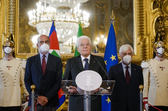 Italian President Sergio Mattarella, center, announces he has dissolved the Italian parliament Thursday, July 21, 2022, after Premier Mario Draghi had confirmed his resignation earlier in the morning. ...