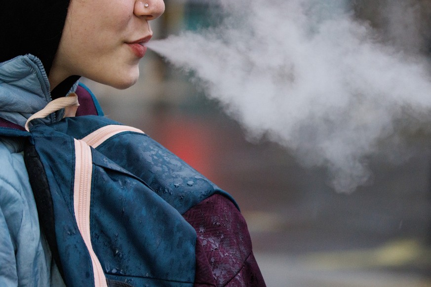epa11244993 Children use vaping products in London, Britain, 26 March 2024. Tadeu Marroco, chief executive of British American Tobacco (BAT), claims the UK government&#039;s Tobacco and Vapes Bill, wh ...