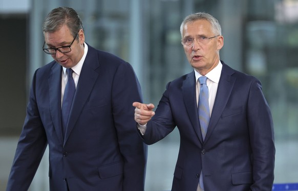 NATO Secretary General Jens Stoltenberg, right, speaks with Serbian President Aleksandar Vucic prior to a meeting at NATO headquarters in Brussels, Wednesday, Aug. 17, 2022. (AP Photo/Olivier Matthys) ...