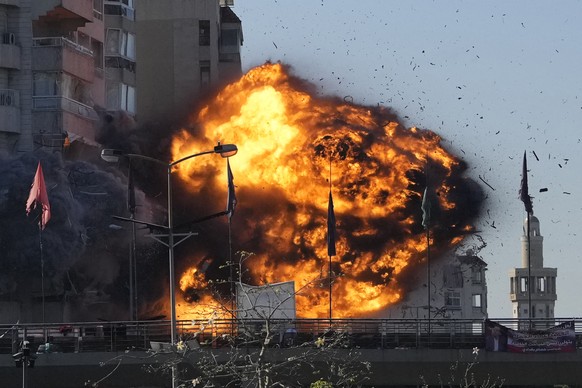 Thick smoke and flames erupt from an Israeli airstrike on Tayouneh, Beirut, Lebanon, Friday, Nov. 15, 2024. (AP Photo/Hassan Ammar)