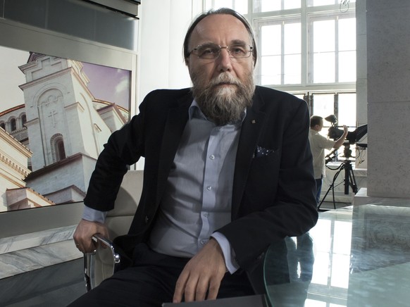 FILE - In this photo taken on Thursday, Aug. 11, 2016, Alexander Dugin, the neo-Eurasianist ideologue, sits in his TV studio in central Moscow, Russia. The daughter of this Russian nationalist ideolog ...