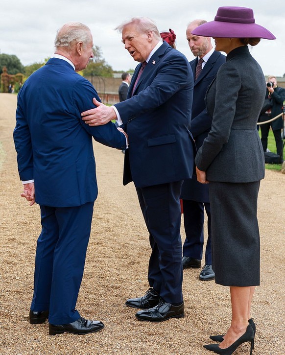 WINDSOR, ENGLAND - SEPTEMBER 17: US President Donald Trump (C) and First Lady Melania Trump (R) are welcomed to Windsor Castle by King Charles III and Queen Camilla on day two of the US President Dona ...