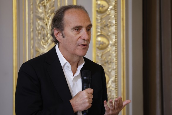 epa11358372 French CEO of Iliad group and Free Telecom Xavier Niel speaks during a meeting with members of Artificial Intelligence sector, at the Elysee Palace in Paris, France, 21 May 2024. EPA/YOAN  ...