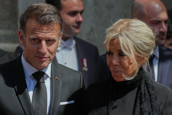 French President Emmanuel Macron and his wife Brigitte leave the St. Damasus Courtyard at the Vatican after meeting with Pope Leo XIV, Friday, April 10, 2026. (AP Photo/Andrew Medichini)
Vatican Pope  ...