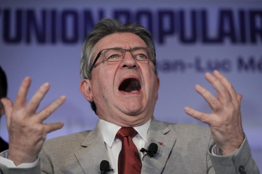 FILE - French far-left candidate Jean-Luc Melenchon comments on preliminary results of the first round of the presidential election in Paris, France, April 10, 2022. Disgruntled left-wing voters whose ...