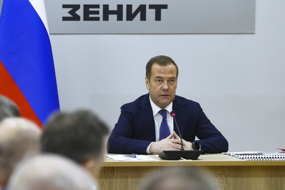Russian Security Council Deputy Chairman and the head of the United Russia party Dmitry Medvedev speaks to employees while visiting PJSC Krasnogorsky Zavod named after Sergei Zverev in Krasnogorsk out ...