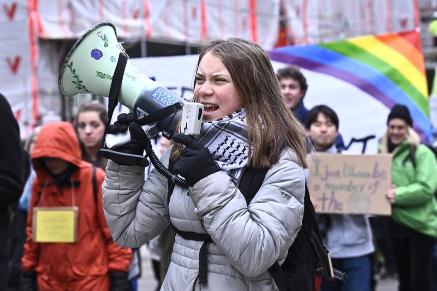 epaselect epa11287940 Swedish climate activist Greta Thunberg (C) attends a global climate strike organized by Fridays for Future movement, in Stockholm, Sweden, 19 April 2024. EPA/CLAUDIO BRESCIANI/T ...