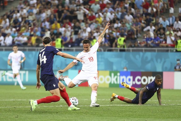 Switzerland&#039;s Mario Gavranovic, center, scores his side&#039;s third goal during the Euro 2020 soccer championship round of 16 match between France and Switzerland at the National Arena stadium,  ...