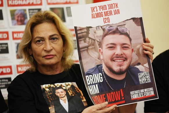epa10985900 Orit Meir whose son Almog Meir Jan is believed kidnapped by Hamas shows a picture of her 21 year old son as she speaks at a press conference of family members of Israeli hostages at the Is ...