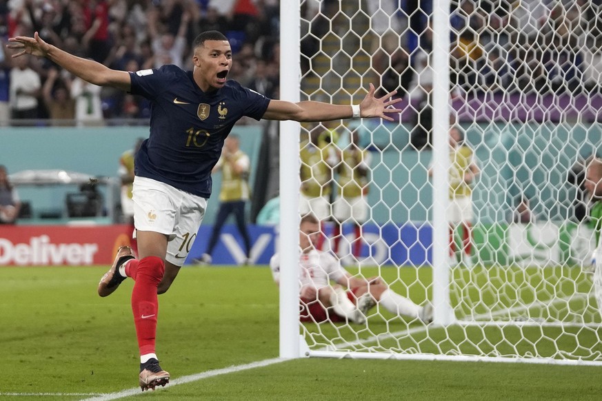 France's Kylian Mbappe celebrates after scoring his sides second goal during the World Cup group D soccer match between France and Denmark, at the Stadium 974 in Doha, Qatar, Saturday, Nov. 26, 2022.  ...