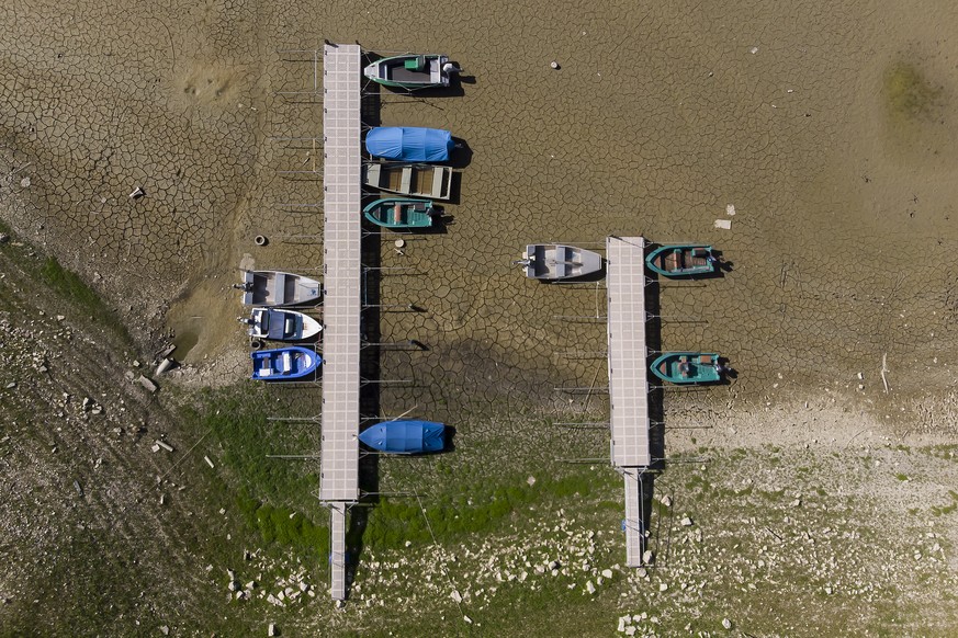 Stranded boats are pictured on the dried out shore of the Brenet Lake (French: Lac des Brenets) part of the Doubs river, a natural border beetwen eastern France and western Switzerland, Monday, July 1 ...