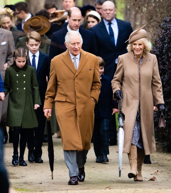 SANDRINGHAM, NORFOLK - DECEMBER 25: Princess Charlotte of Wales, Prince George of Wales, King Charles III, Prince William, Prince of Wales, Prince Louis of Wales, Queen Camilla attend the Christmas Mo ...