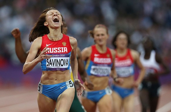 LONDON, ENGLAND - AUGUST 11: Mariya Savinova of Russia is seen on her way to victory in the Women&#039;s 800m Final, Savinova was later stripped of her 800m title and banned after being found guilty o ...