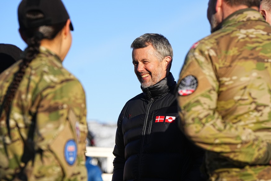 epaselect epa12755016 Danish King Frederik X (C) visits Arctic Basic Training and Arctic Command in Nuuk, Greenland, 18 February 2026. The king is on a three-day visit to Greenland. EPA/Bo Amstrup DEN ...