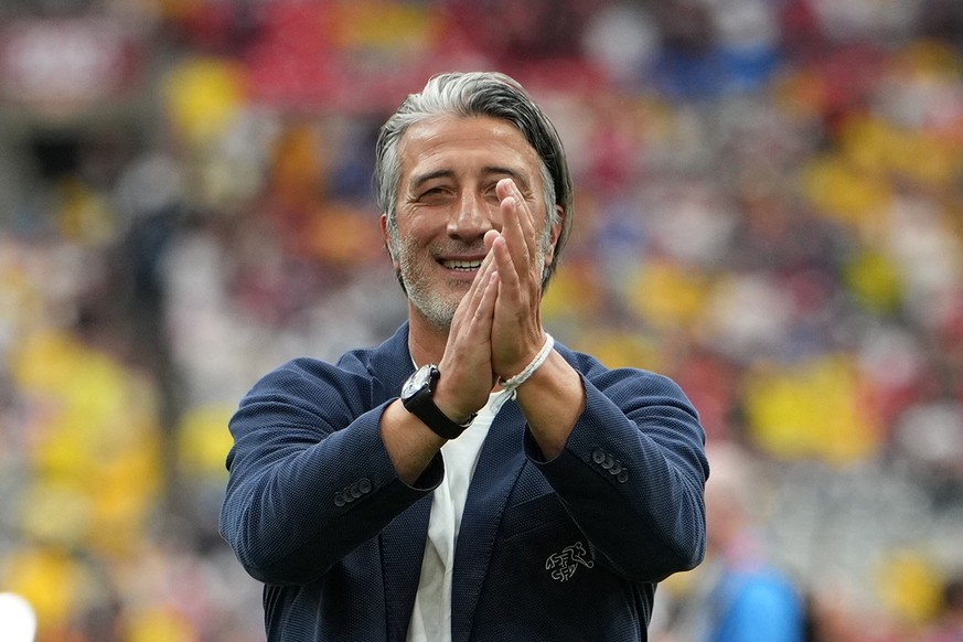 epa13096786 Switzerland's head coach Murat Yakin celebrates with their supporters after winning of the FIFA World Cup 2026 Round of 16 match Switzerland against Colombia, in Vancouver, Canada, 07 ...
