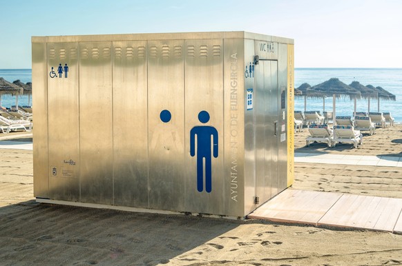 FUENGIROLA, SPAIN - OCTOBER 9, 2021: Toilets on the beach in Fuengirola, located on the Costa del Sol, Andalusia, southern Spain